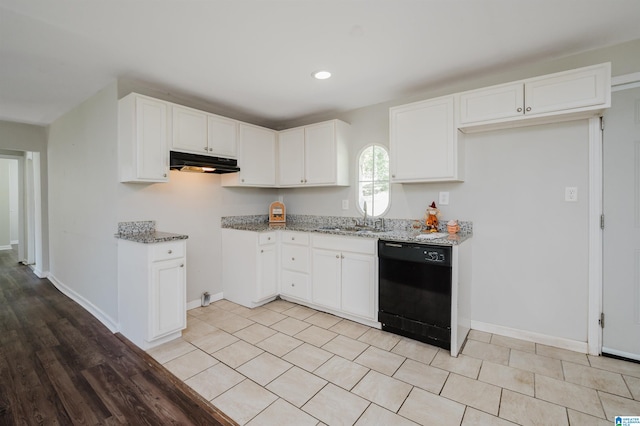 kitchen featuring light stone counters, dishwasher, and white cabinetry