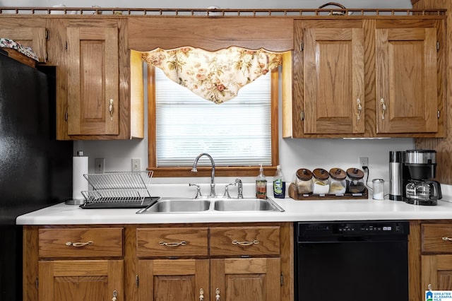 kitchen with black dishwasher and sink