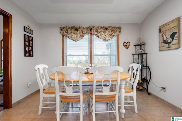 dining area featuring light tile patterned floors