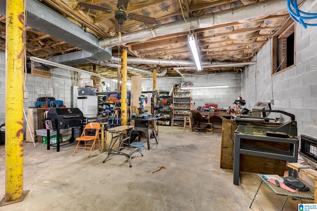 basement with heating unit and a workshop area