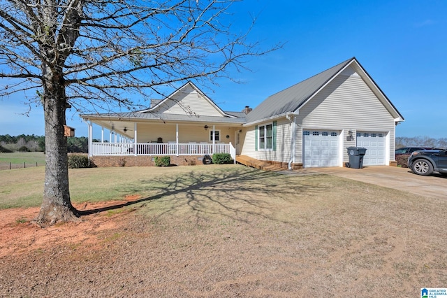 view of front of house featuring a garage, a front lawn, and covered porch