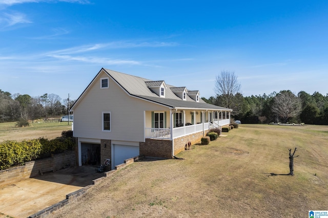 view of property exterior with covered porch, a lawn, and a garage