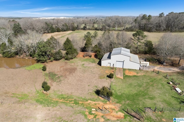 birds eye view of property with a rural view