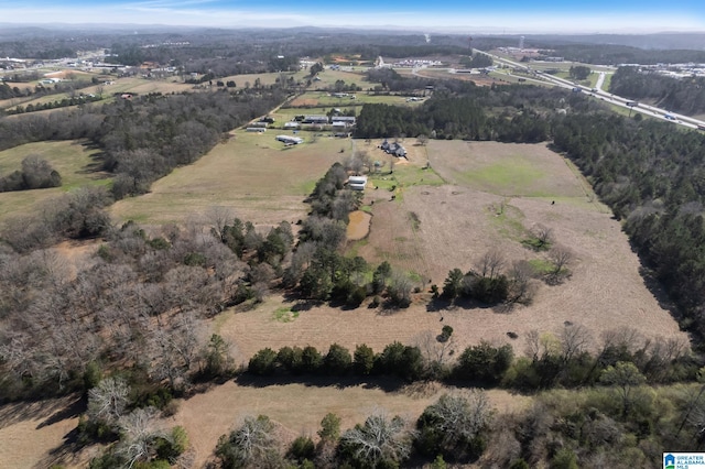 birds eye view of property featuring a rural view