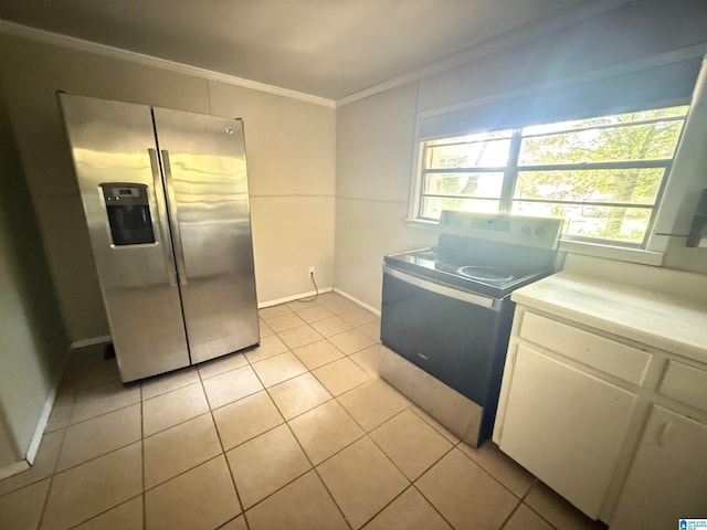 kitchen with stove, white cabinetry, ornamental molding, light tile patterned floors, and stainless steel refrigerator with ice dispenser