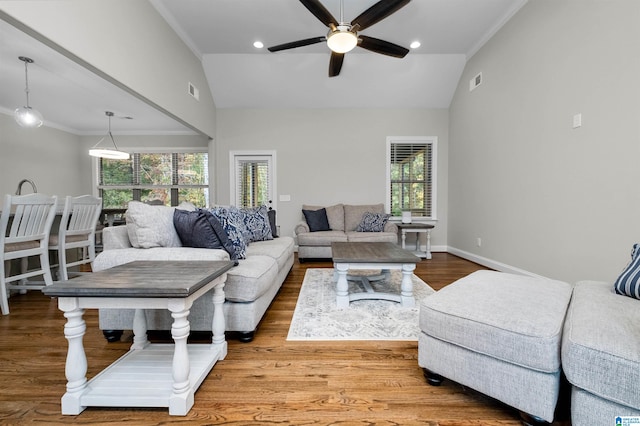 living room with vaulted ceiling, plenty of natural light, and ceiling fan