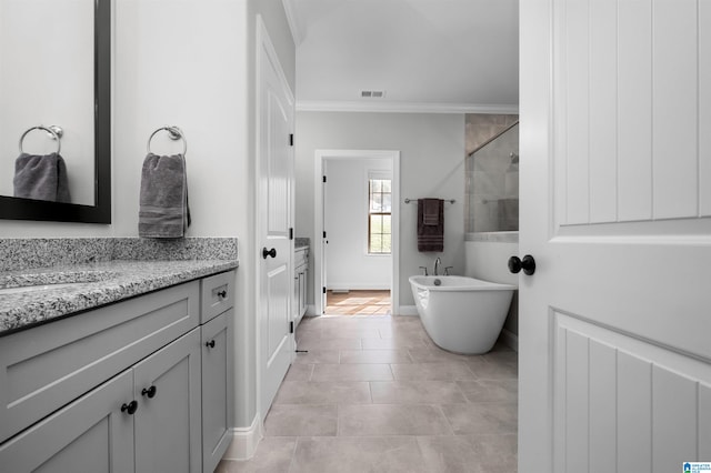 bathroom featuring tile patterned flooring, vanity, ornamental molding, and independent shower and bath