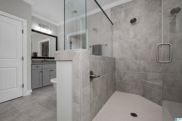 bathroom with vanity, a shower with door, and crown molding