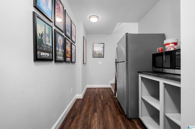 corridor featuring dark hardwood / wood-style flooring