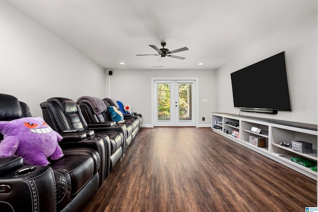 cinema room with ceiling fan, dark wood-type flooring, and french doors