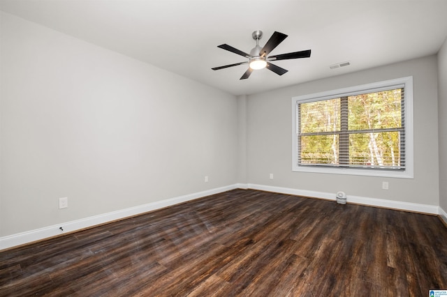 empty room featuring ceiling fan and dark hardwood / wood-style floors