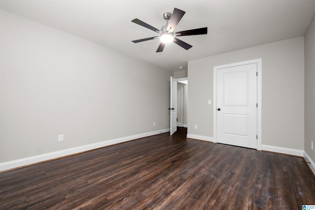 unfurnished bedroom featuring dark hardwood / wood-style floors and ceiling fan