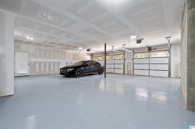 garage featuring a carport and a garage door opener