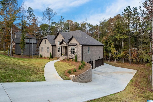 view of front of home featuring a garage and a front lawn