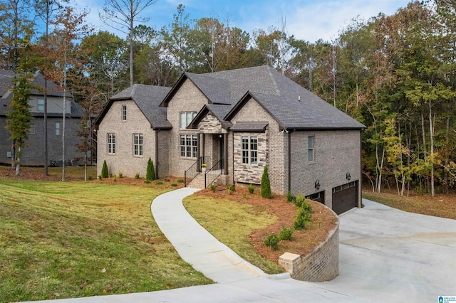 french provincial home with a front yard and a garage