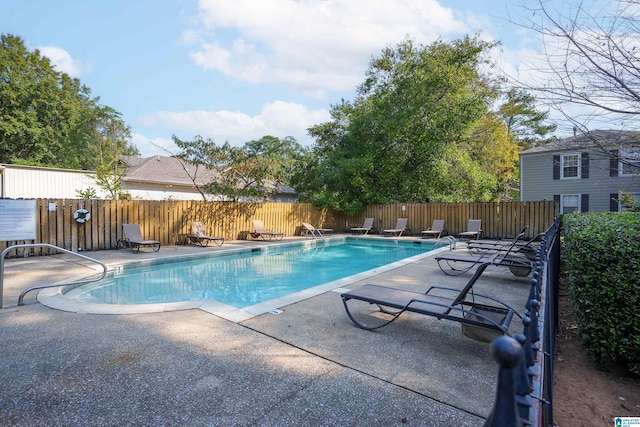 view of swimming pool with a patio