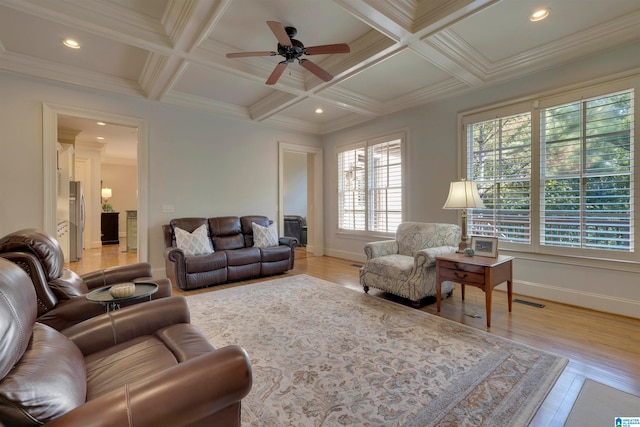 living room featuring coffered ceiling, light wood-type flooring, beamed ceiling, and ceiling fan