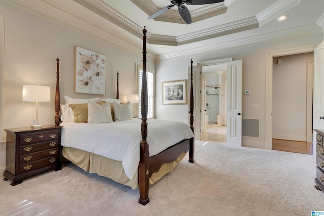 bedroom with ornamental molding, light colored carpet, and ceiling fan