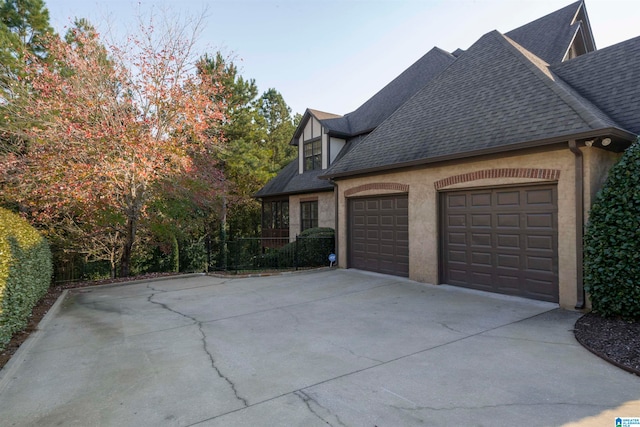 view of side of home with a garage