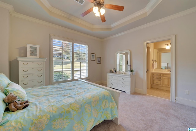 bedroom featuring light carpet, crown molding, ensuite bathroom, and ceiling fan