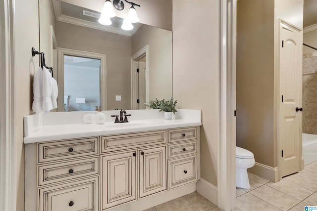 bathroom featuring vanity, ornamental molding, a tub to relax in, tile patterned floors, and toilet