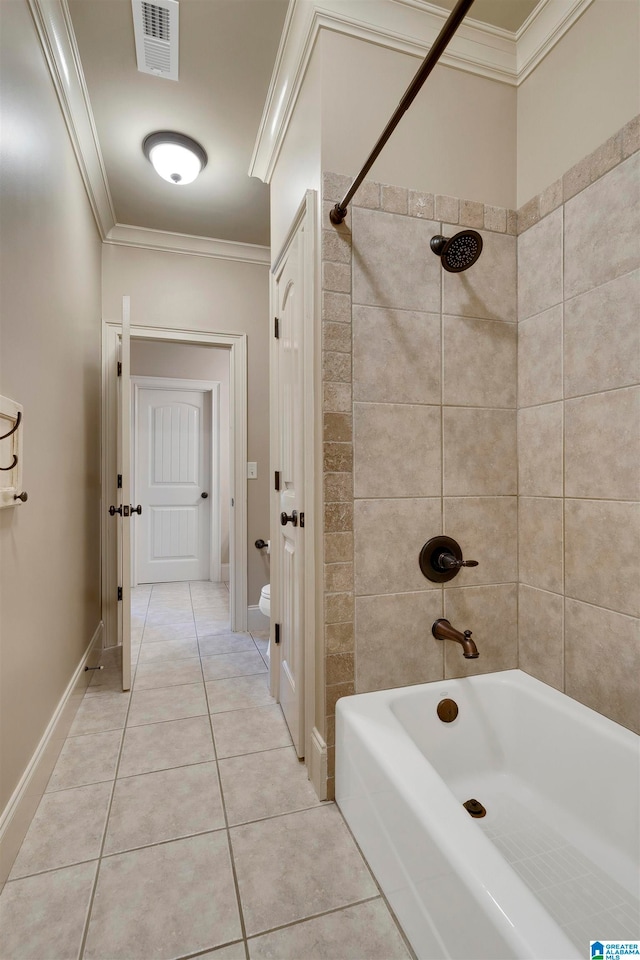 bathroom featuring ornamental molding, tiled shower / bath combo, and tile patterned floors