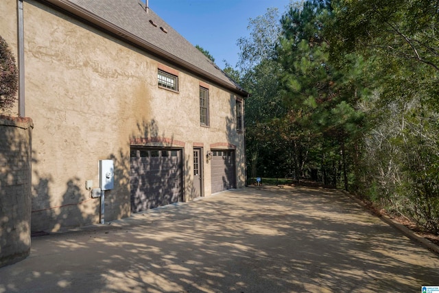 view of side of home with a garage