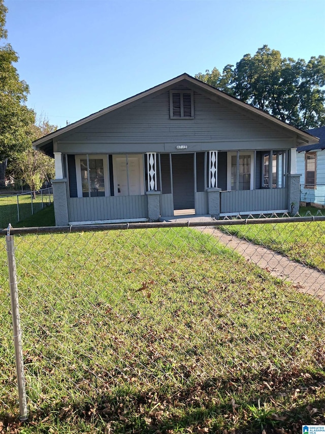 view of front facade with a front lawn and a porch