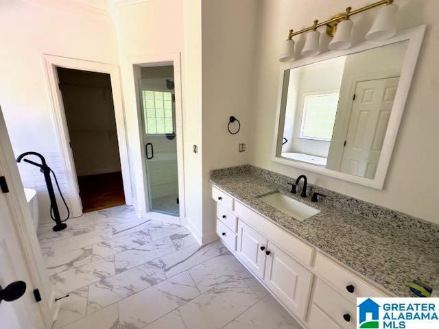 bathroom with vanity and an enclosed shower