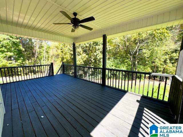 wooden terrace featuring ceiling fan