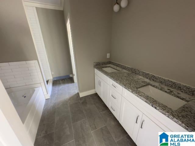 bathroom with vanity and a bathing tub