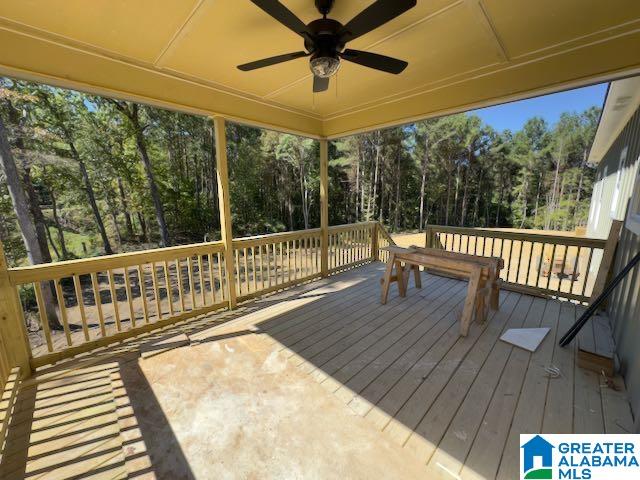 wooden deck featuring ceiling fan