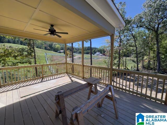 wooden deck with ceiling fan