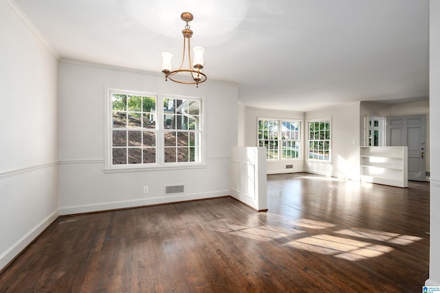 unfurnished room featuring baseboards, visible vents, dark wood-style floors, ornamental molding, and a chandelier