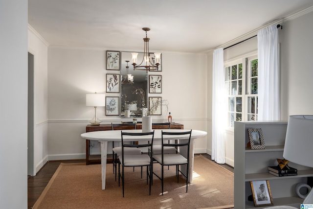 177 Ross Dr, Mountain Brook, AL 35213 - dining area with crown molding, wood finished floors, a chandelier, and baseboards