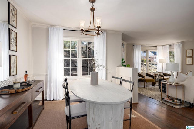 177 Ross Dr, Mountain Brook, AL 35213 - dining area featuring dark wood finished floors, a chandelier, and ornamental molding