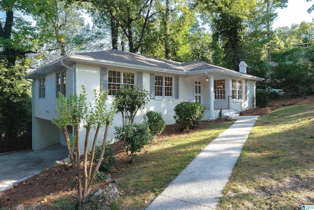 177 Ross Dr, Mountain Brook, AL 35213 - view of front of property featuring brick siding, a porch, a chimney, and a front lawn