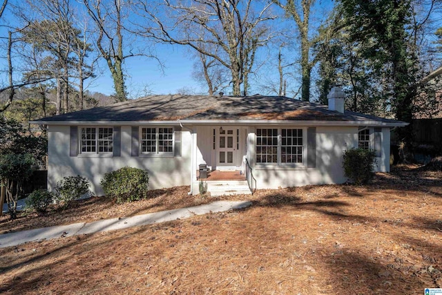 ranch-style house with a chimney