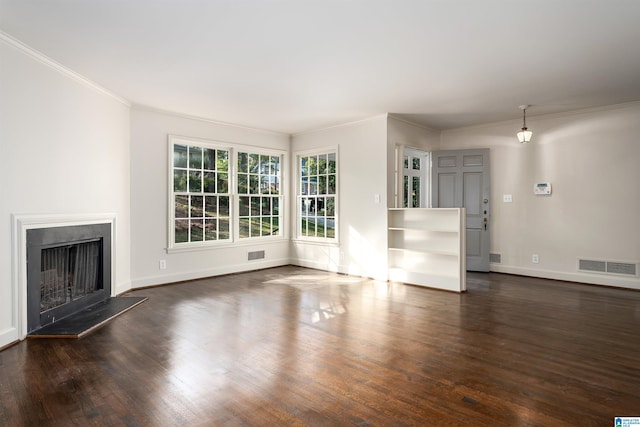 unfurnished living room with a fireplace with raised hearth, dark wood-style flooring, visible vents, and baseboards