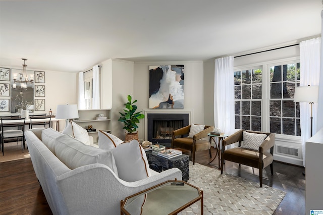 177 Ross Dr, Mountain Brook, AL 35213 - living area with dark wood-type flooring, a fireplace, and a chandelier