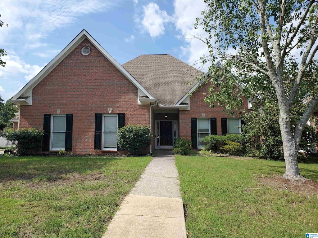 front facade with a front lawn