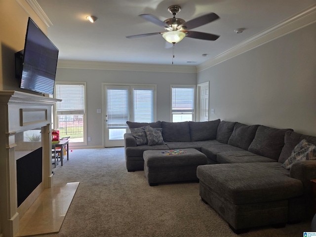 living room featuring crown molding, light colored carpet, and ceiling fan