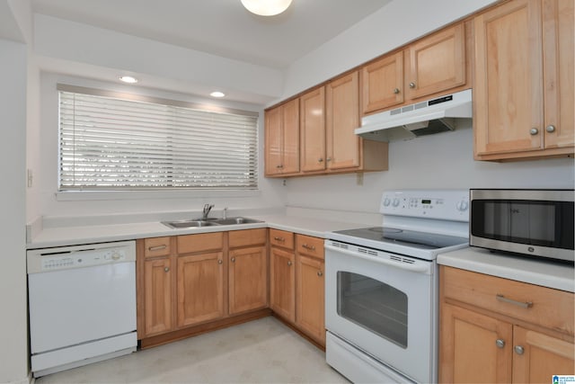 kitchen with sink and white appliances