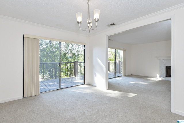 interior space featuring ornamental molding, a fireplace, a notable chandelier, and light colored carpet