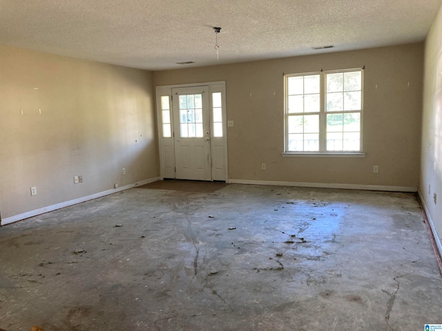 interior space with a textured ceiling