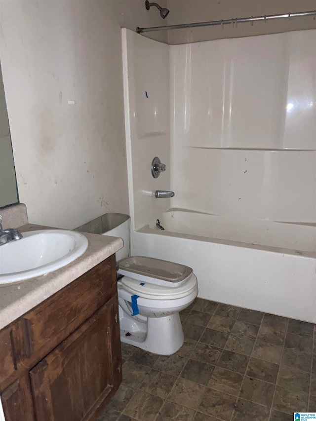 full bathroom featuring shower / tub combination, toilet, and vanity