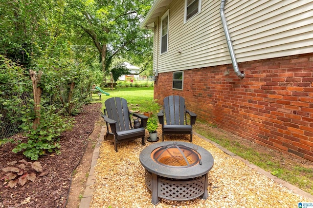 view of patio featuring an outdoor fire pit