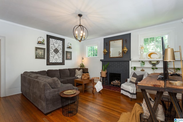 living room featuring a brick fireplace, plenty of natural light, and crown molding