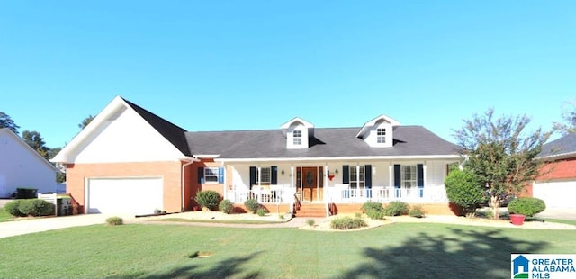 cape cod-style house with a porch, a garage, and a front lawn