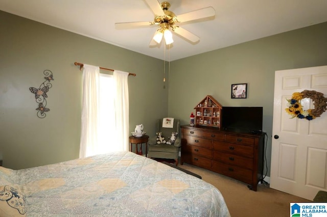 carpeted bedroom featuring ceiling fan